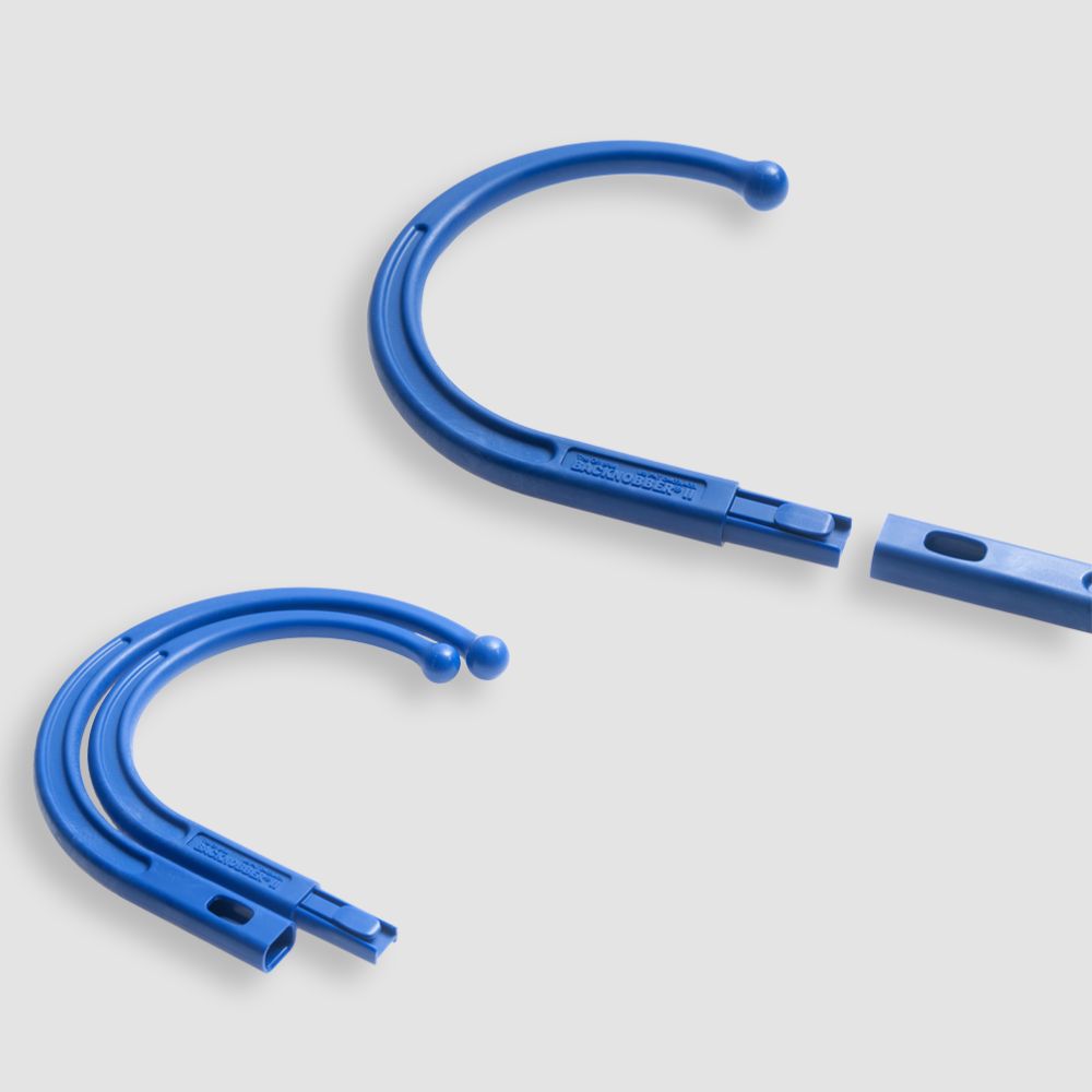 Backnobber II S-shaped trigger point massage tool showing ergonomic design and portability features
