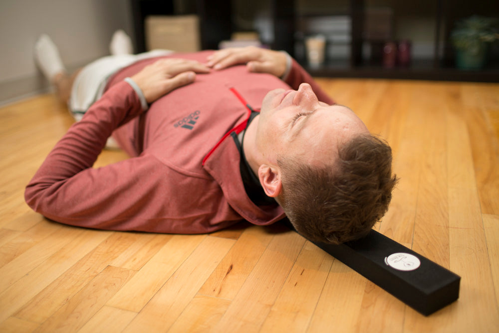lie on the Beam to correct your posture and relax tight back & shoulder muscles
