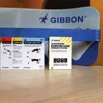 Gibbon slackboard and exercise card workout system on a wooden surface