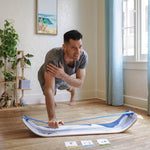 Person using SlackBoard Exercise Cards for balance training workout at home
