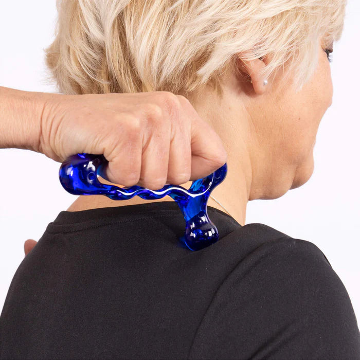 Person using Index Knobber II for shoulder trigger point relief