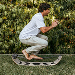 Athlete performing balance and mobility exercises on SlackBoard Plus Moon, now shipping from Canada